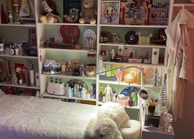 Inviting treatment room at Doctor Massage, London, England, GB with decor and plush bedding.