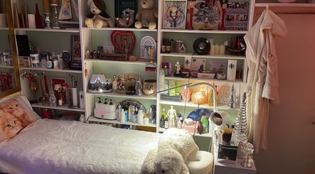 Inviting treatment room at Doctor Massage, London, England, GB with decor and plush bedding.