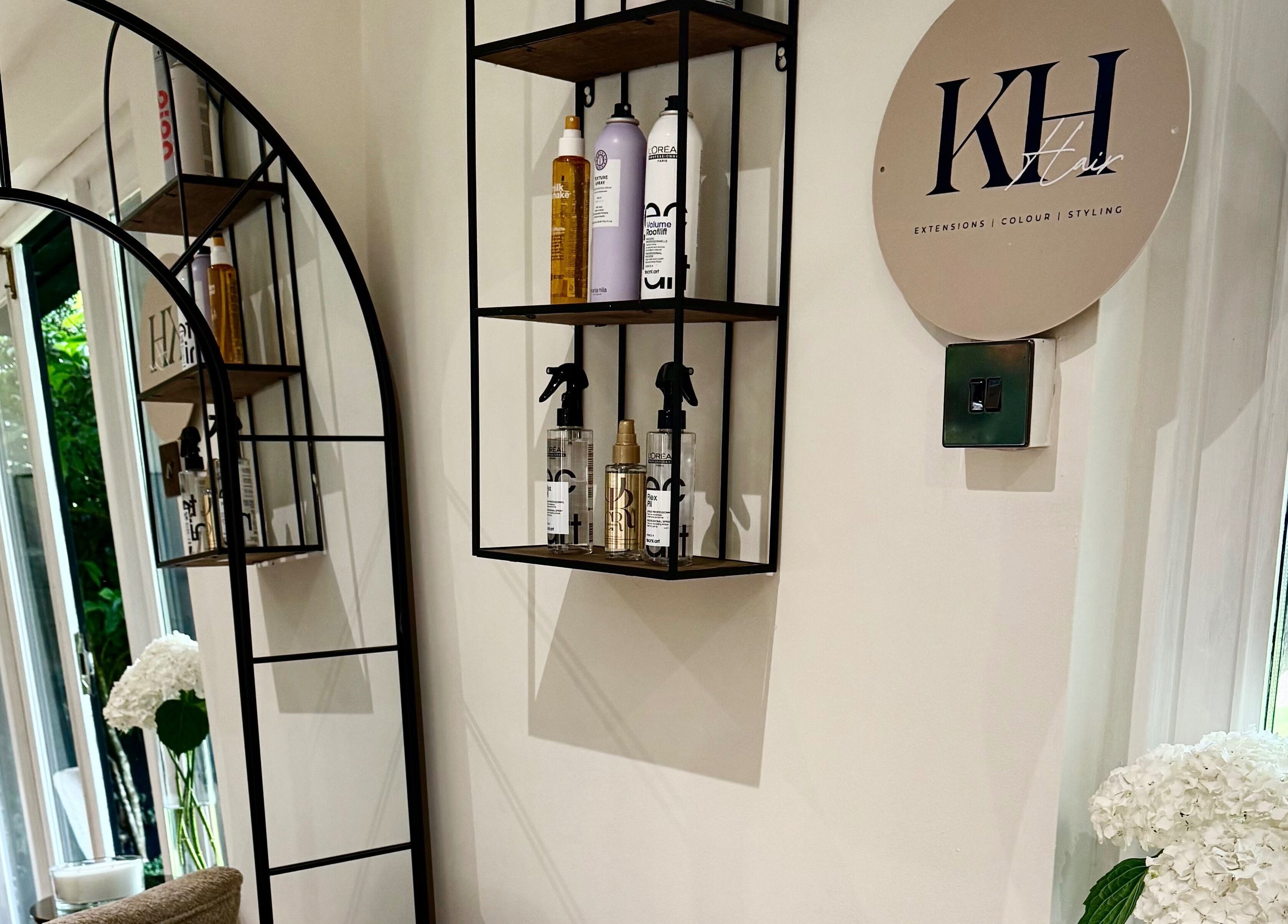 Elegant KH Hair salon interior with products on shelves in Edenbridge, England, GB.