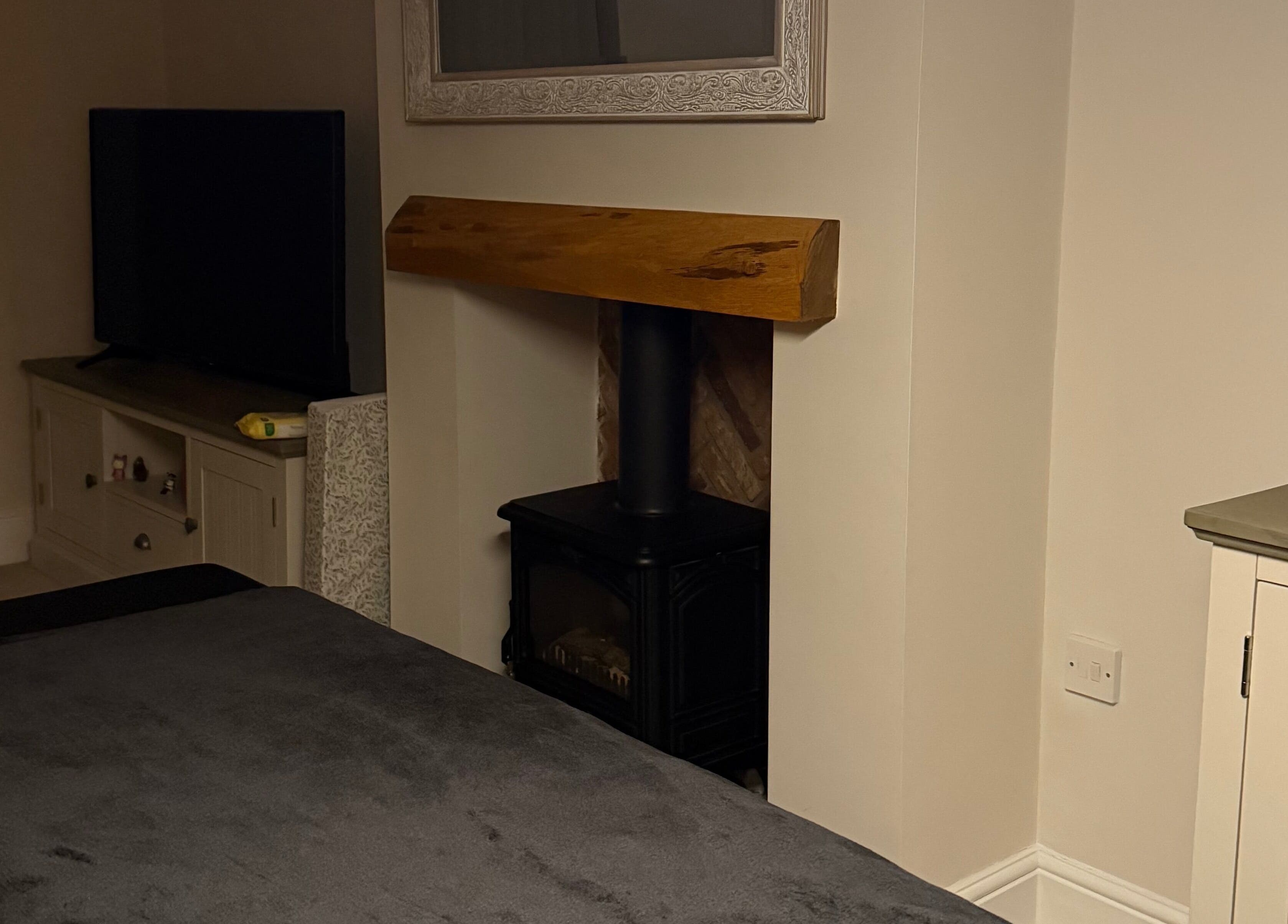 Relaxing interior of Naturabelle Aesthetics in Barlow, England featuring a cozy fireplace and decor.