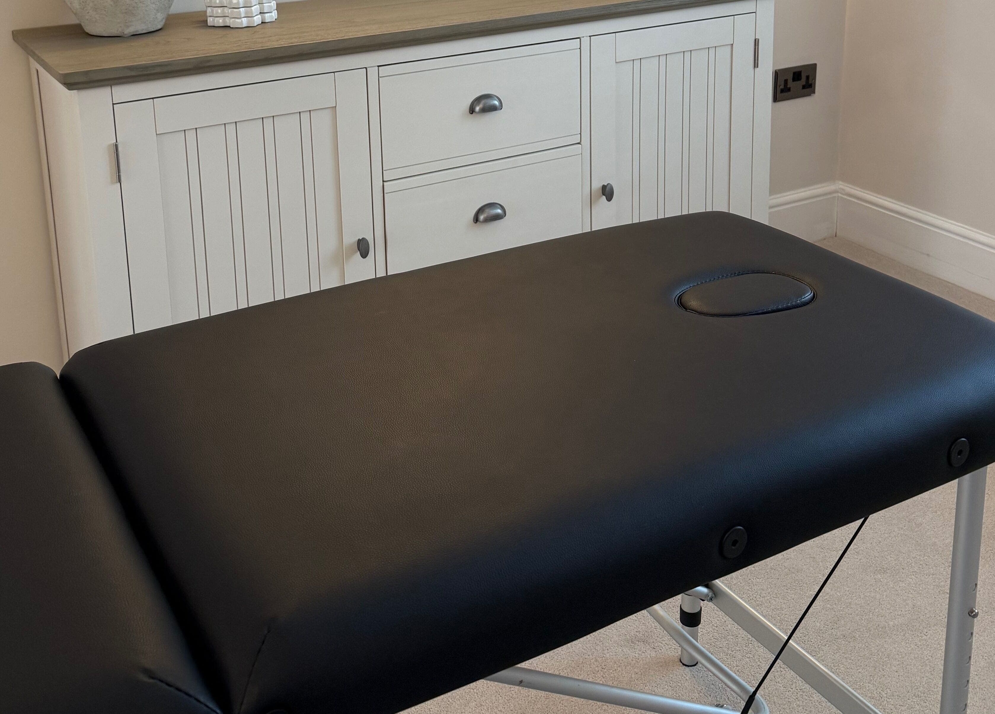 Massage table at Naturabelle Aesthetics in Barlow, England, GB offering a relaxing treatment experience.
