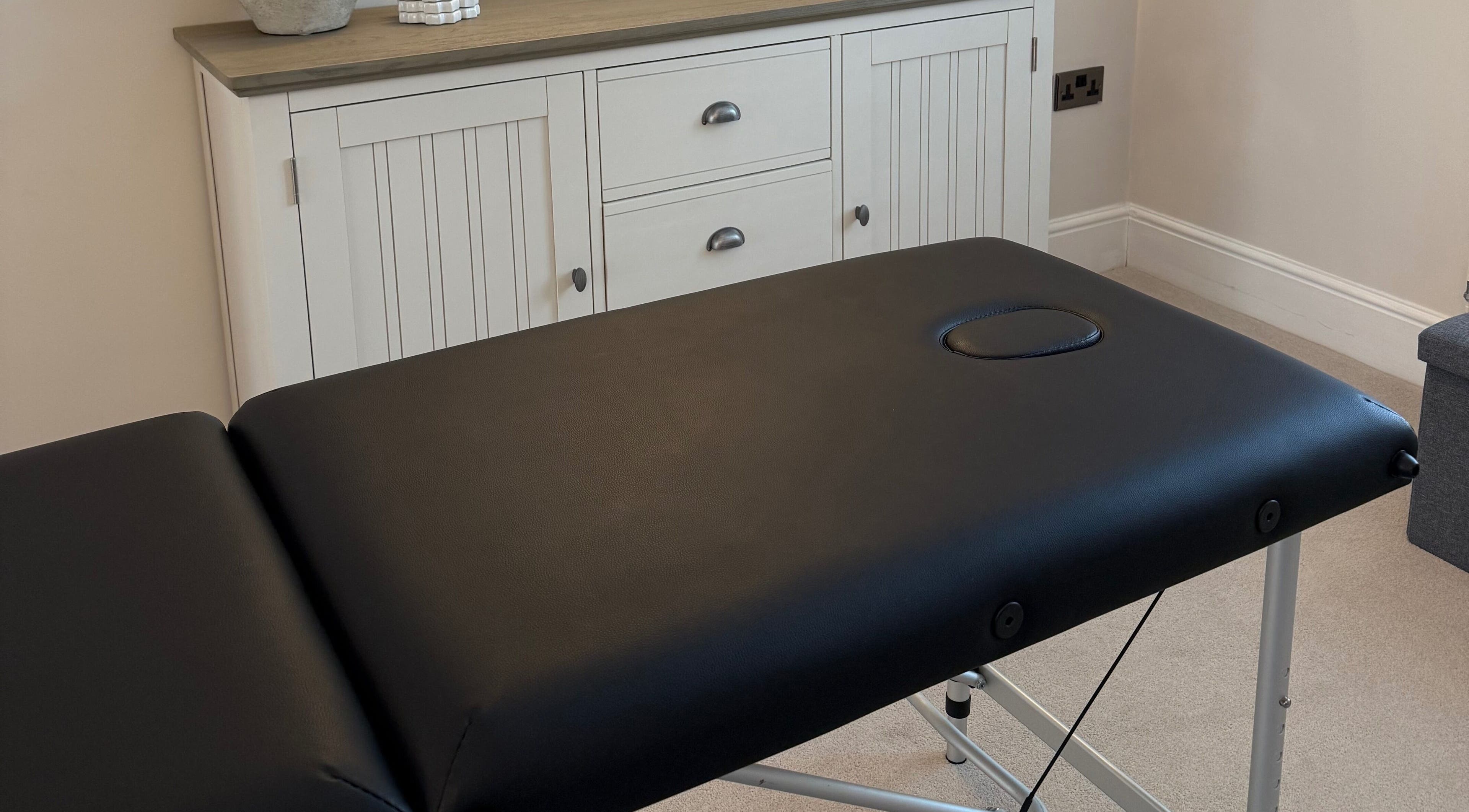 Massage table at Naturabelle Aesthetics in Barlow, England, GB offering a relaxing treatment experience.