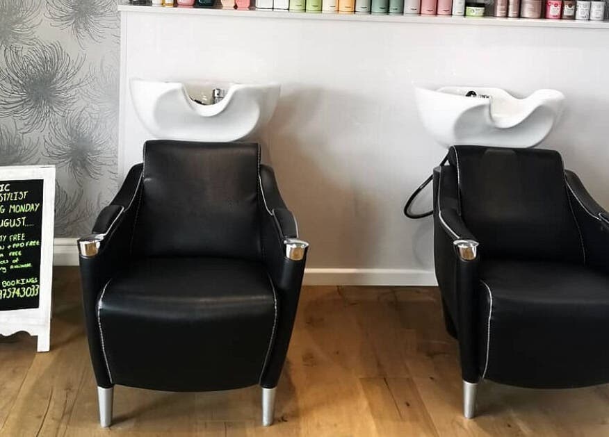 Modern washbasin chairs at Glow Hair and Beauty Salon, Sutton Coldfield, England, GB.