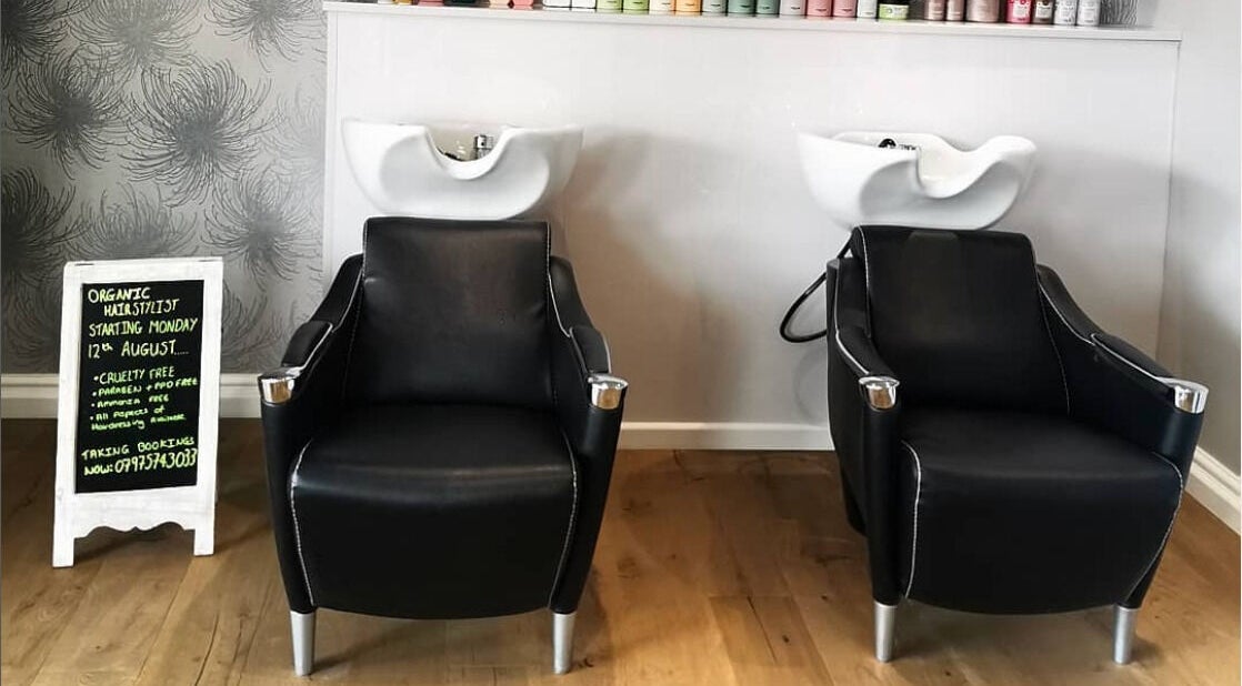 Modern washbasin chairs at Glow Hair and Beauty Salon, Sutton Coldfield, England, GB.