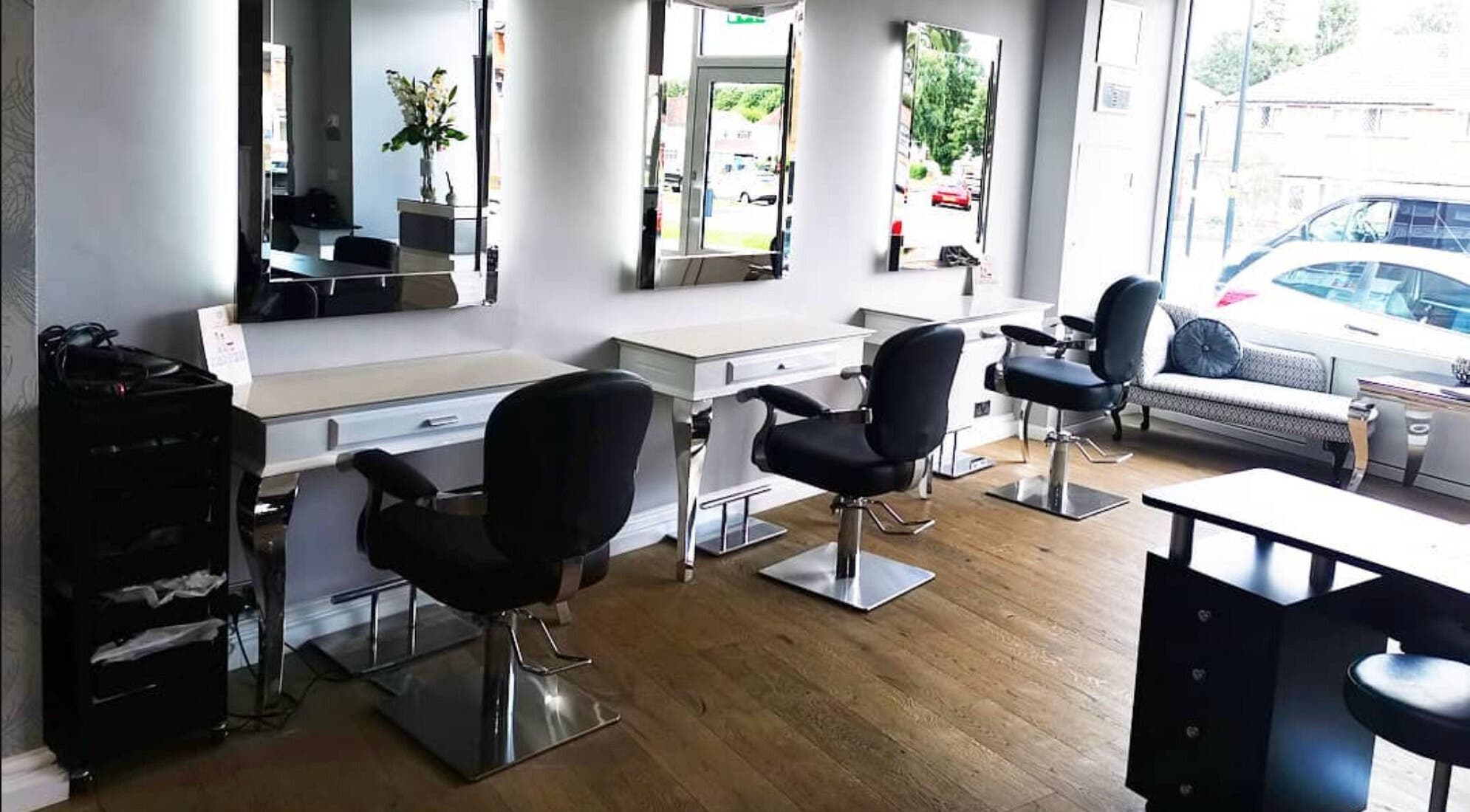 Spacious and chic interior of Glow Hair and Beauty Salon in Sutton Coldfield, England, GB with modern salon chairs.