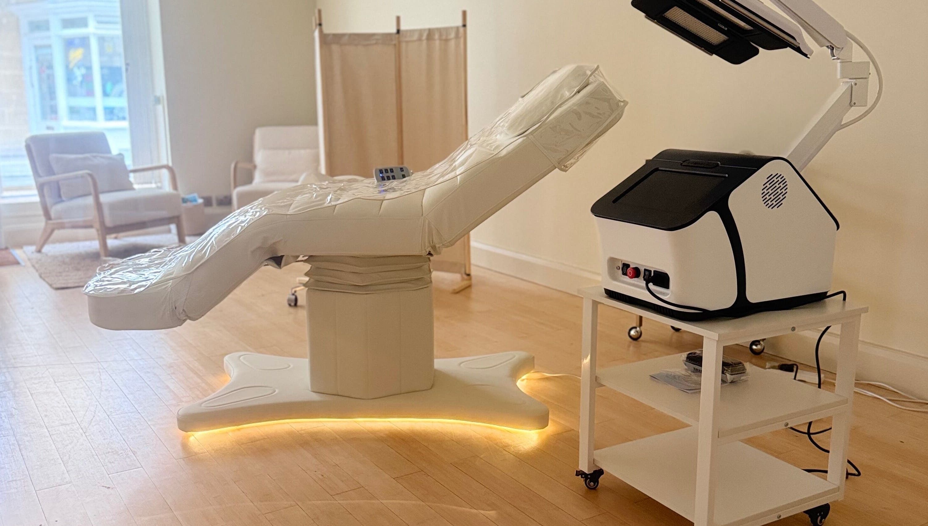 Modern treatment room at Brock Aesthetics, Bath, England, GB, with advanced equipment and serene ambiance.
