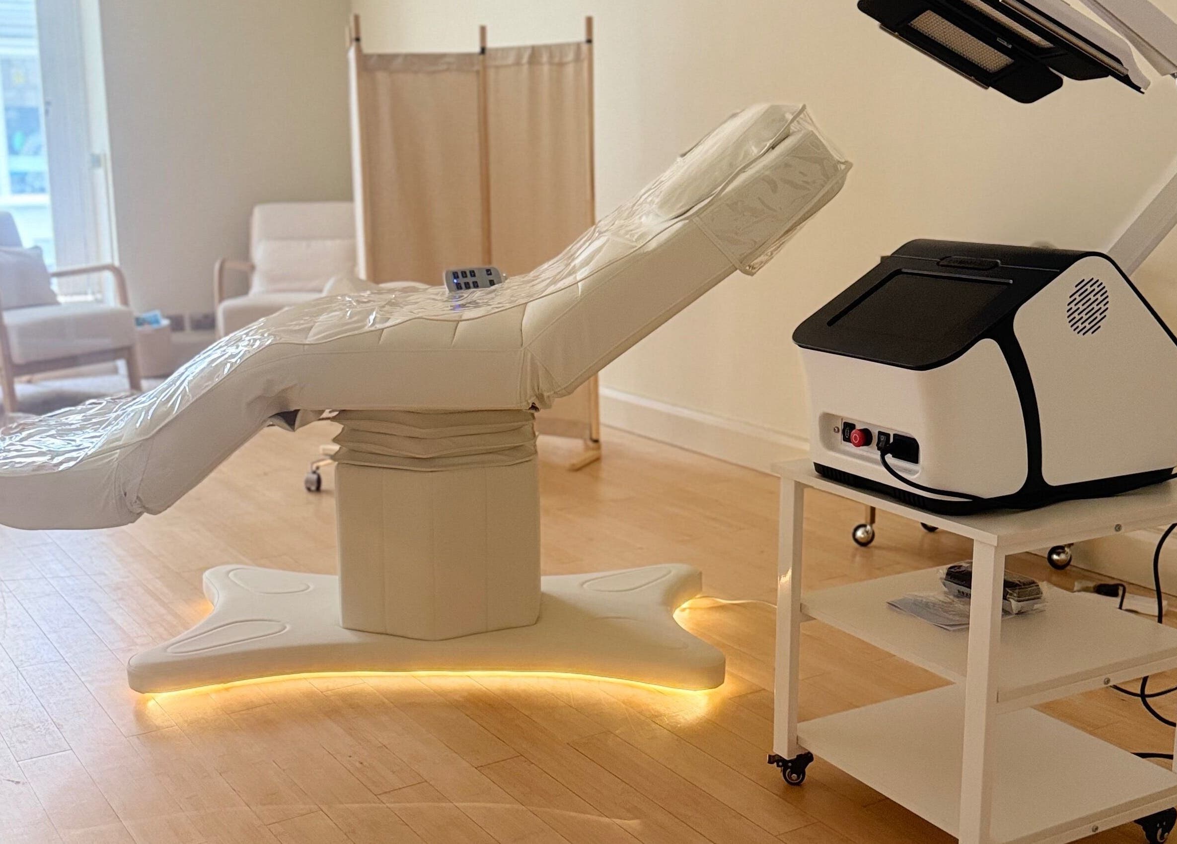 Modern treatment room at Brock Aesthetics, Bath, England, GB, with advanced equipment and serene ambiance.
