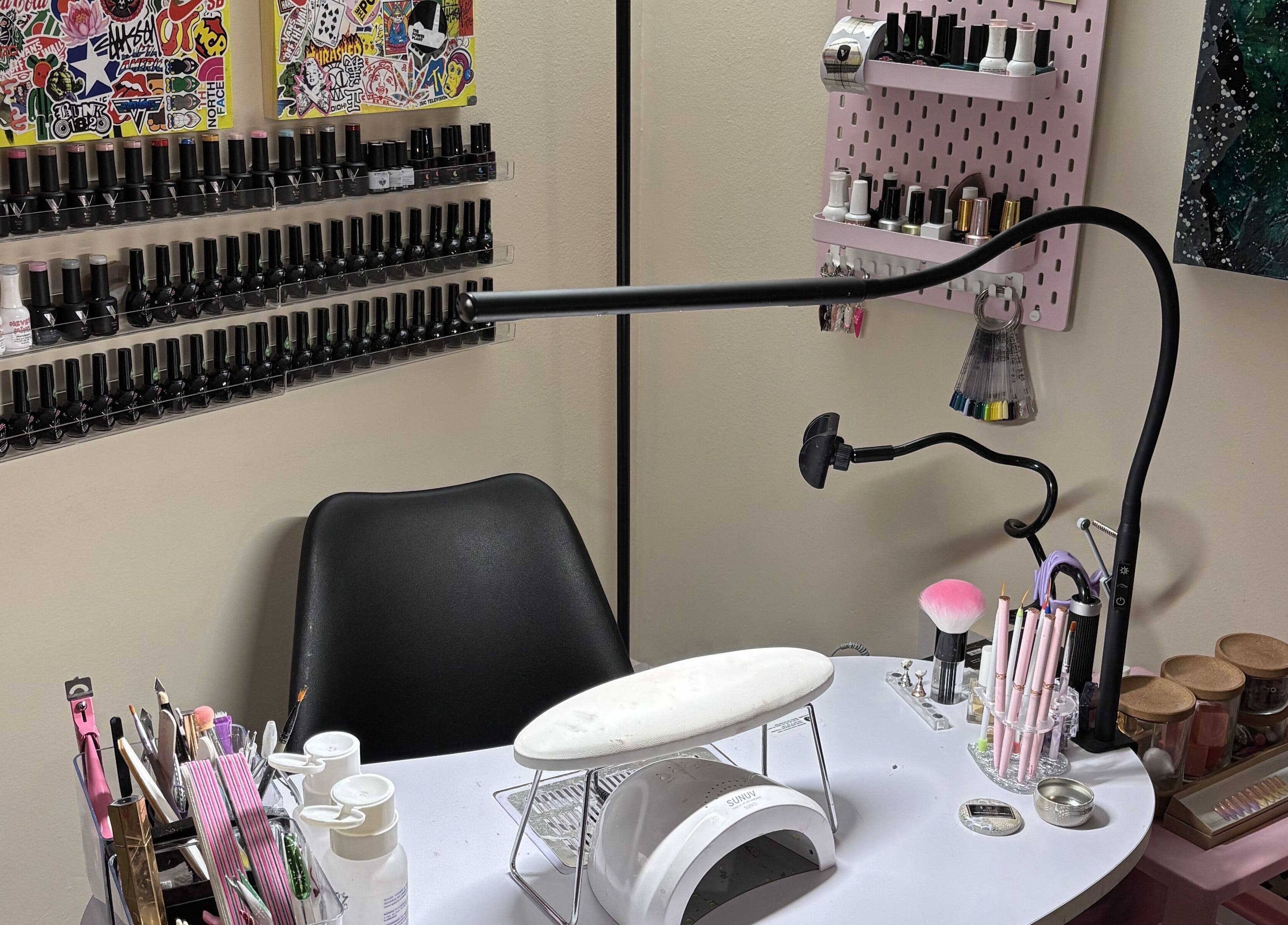 Nail station at Ren The Nail Fairy, showcasing polish collection and tools in Toronto, Ontario, CA.