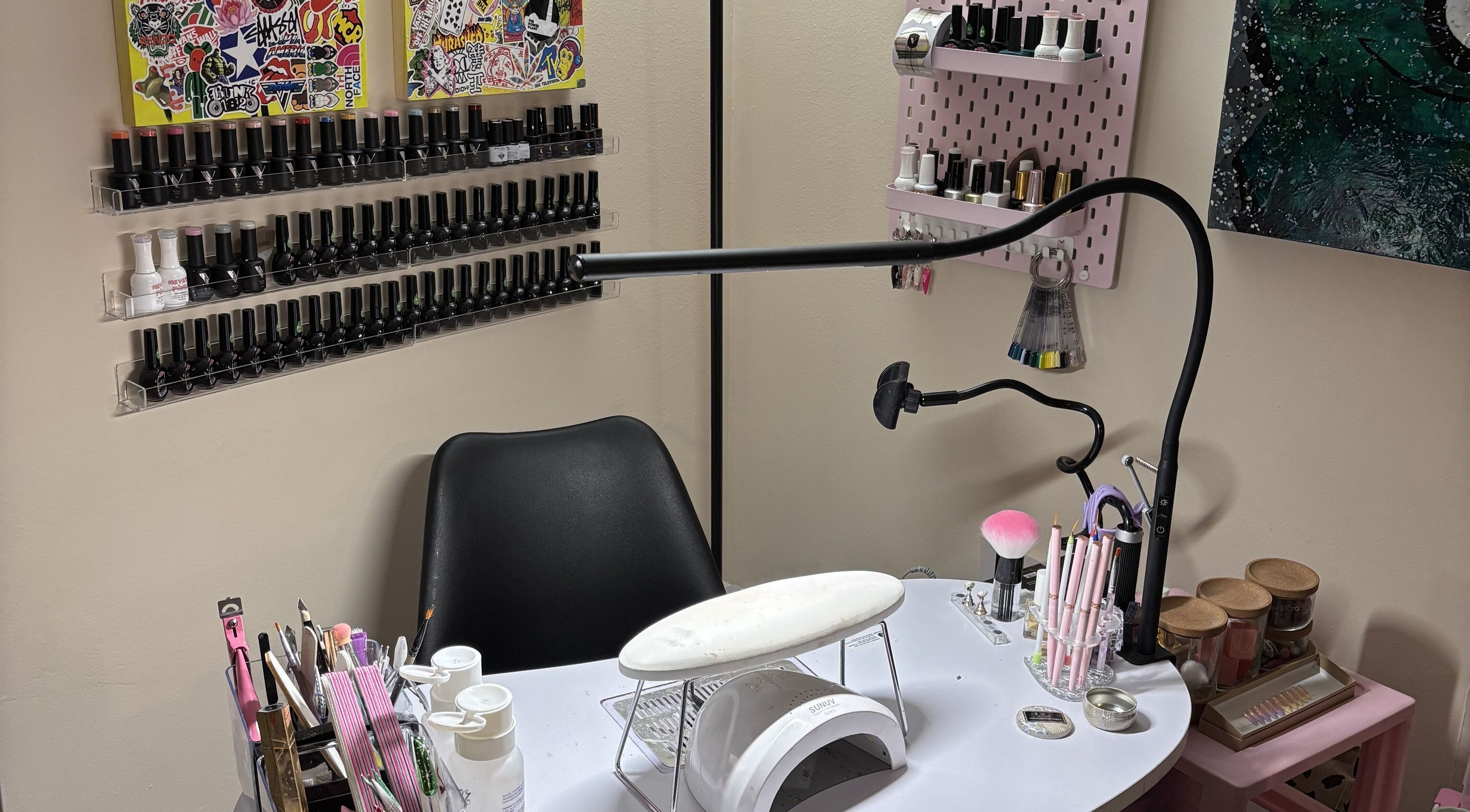 Nail station at Ren The Nail Fairy, showcasing polish collection and tools in Toronto, Ontario, CA.