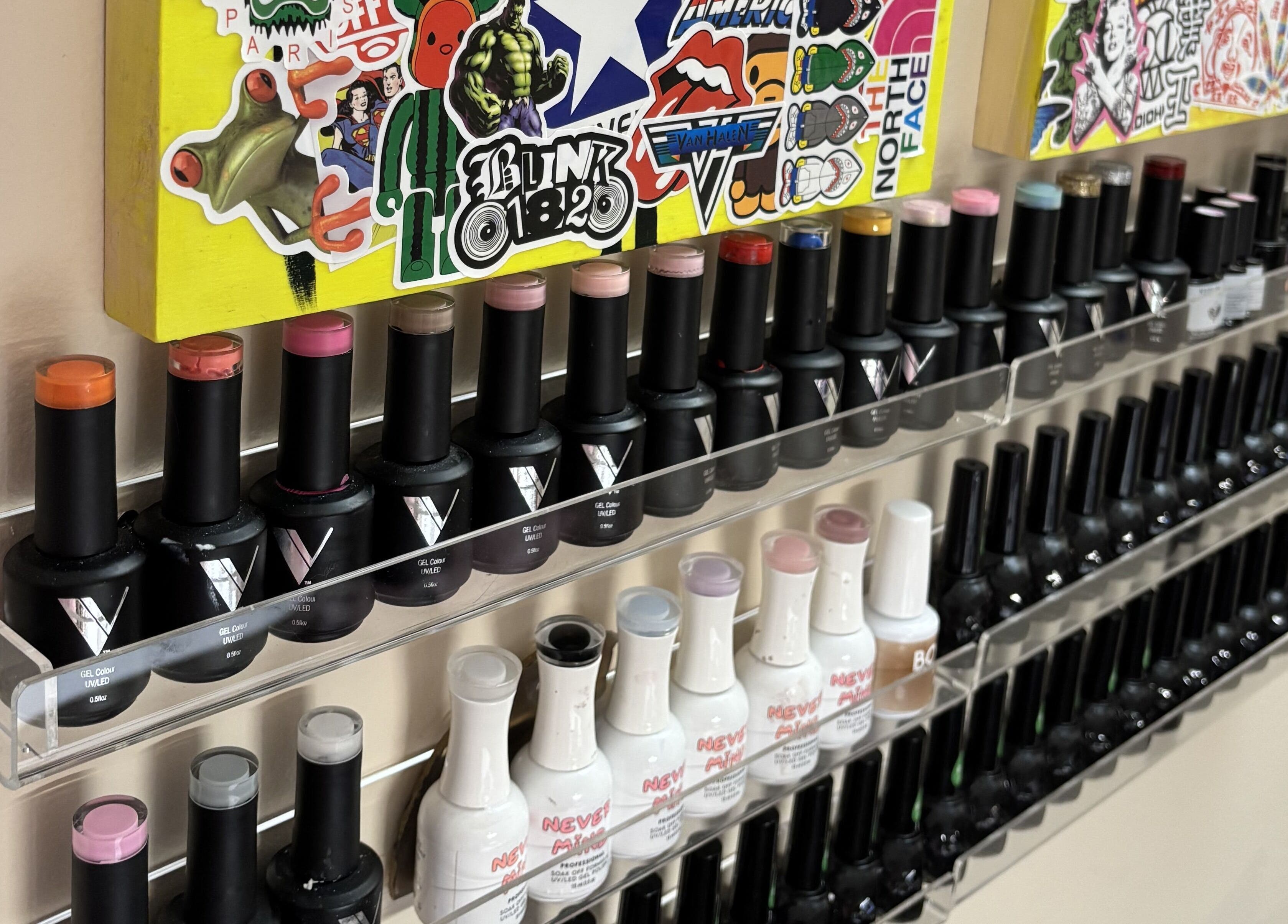 Vibrant nail polish collection at Ren The Nail Fairy, Toronto, Ontario, CA, showcasing diverse colors.