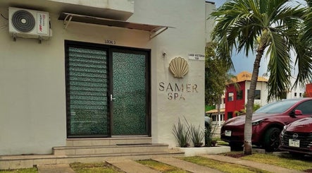 Entrada de Samer Spa en Puerto Vallarta, Jalisco, MX, rodeada de vegetación tropical.