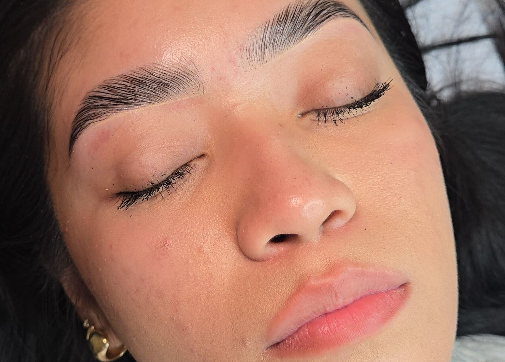 Close-up of perfectly groomed eyebrows at Esthetics X Mayra, New Caney, Texas, US.