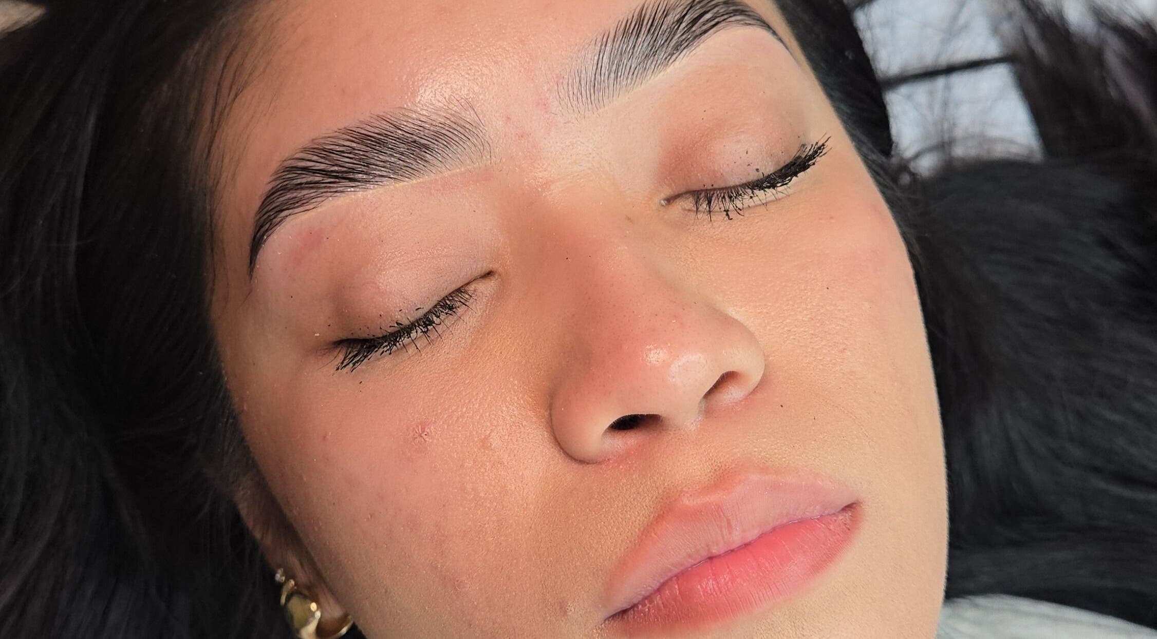 Close-up of perfectly groomed eyebrows at Esthetics X Mayra, New Caney, Texas, US.