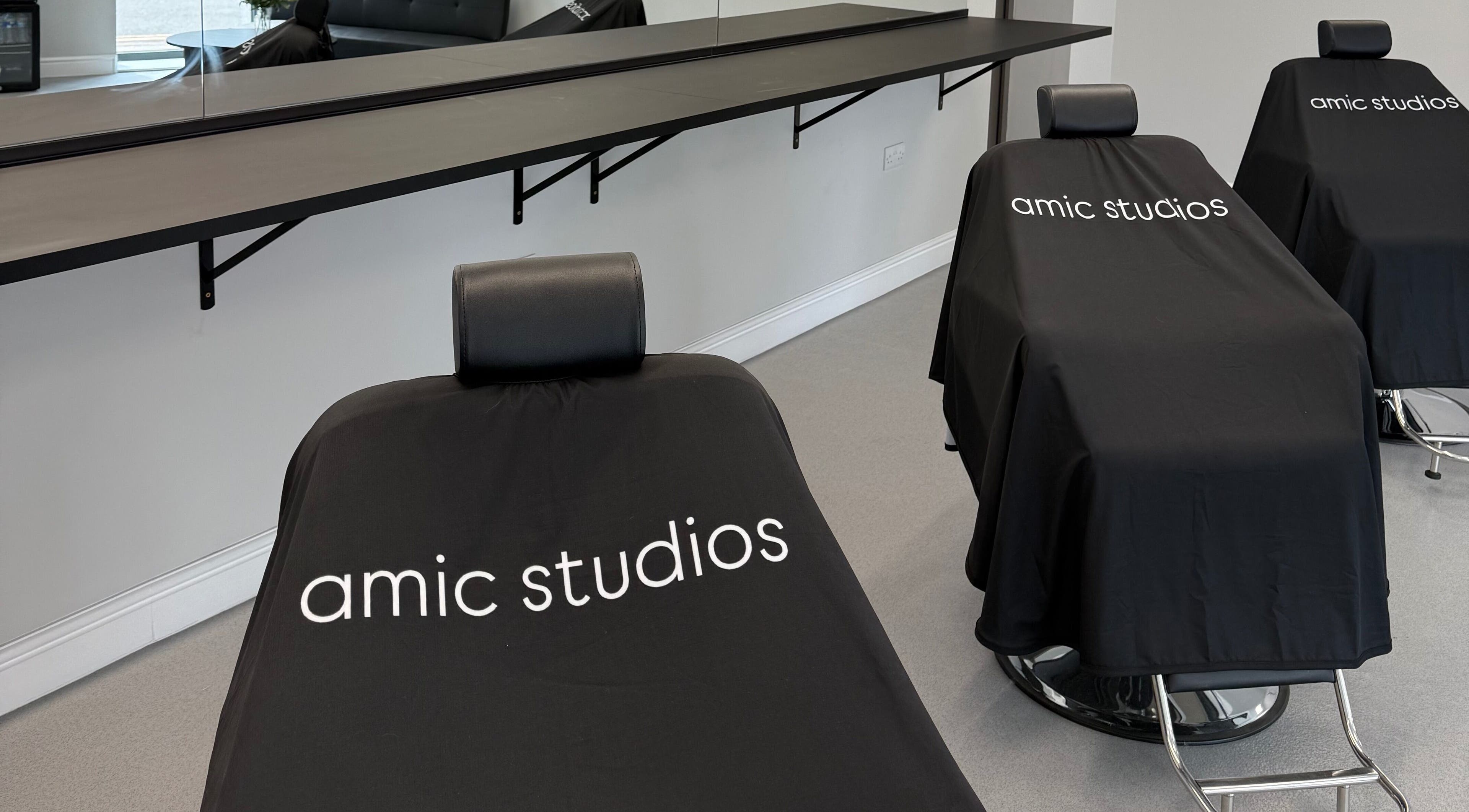 Modern salon chairs at Amic Studios, Birstall, England, GB, showcasing sleek design and comfort.