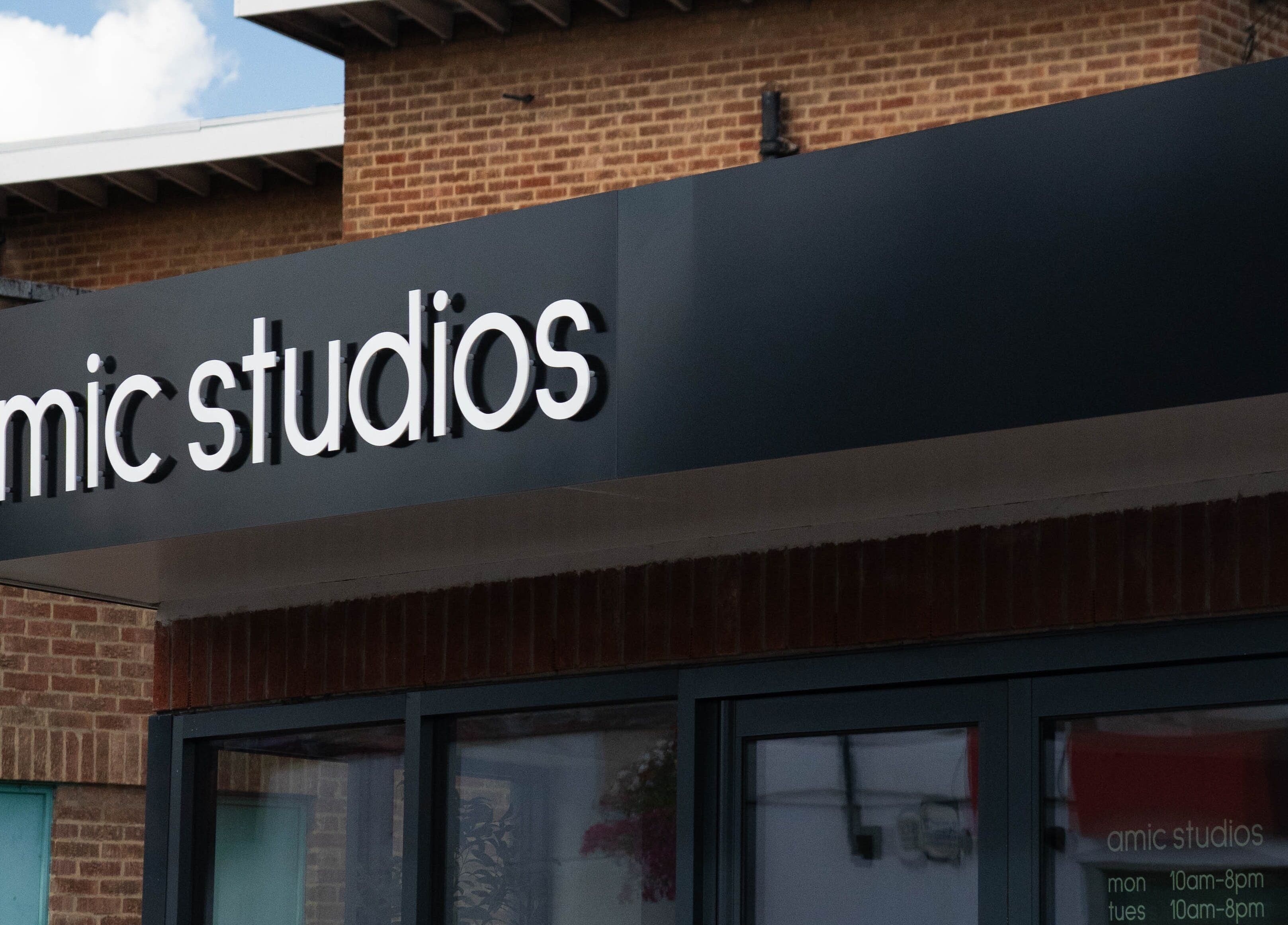 Front view of Amic Studios entrance in Birstall, England, GB with modern signage.