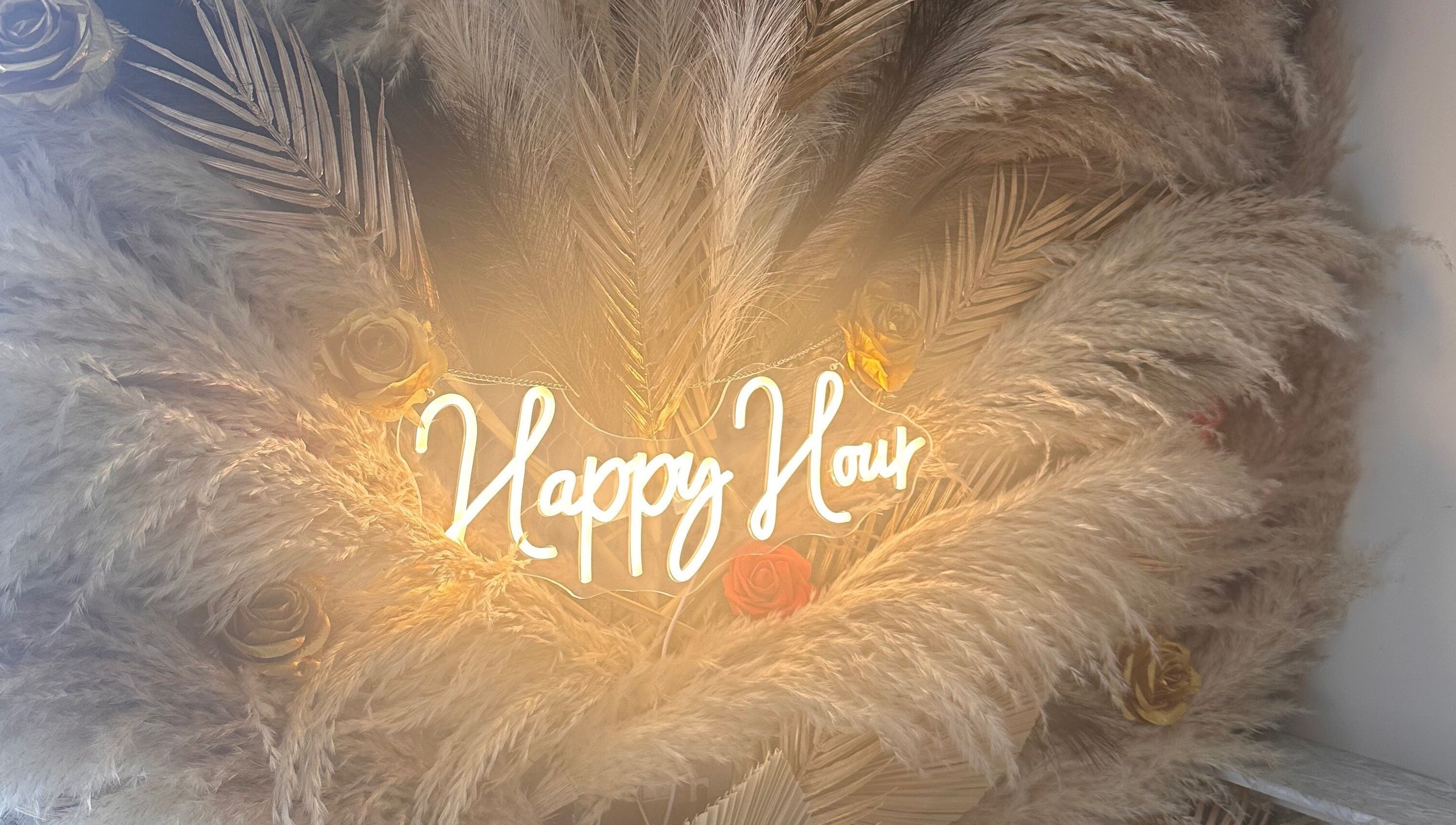 Elegant pampas and roses with 'Happy Hour' sign at The Beauty Bar by Chloe, Kirkcaldy, Scotland, GB.