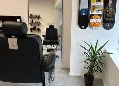 Modern barbershop interior at Handsome Jacks Whitley Bay, featuring sleek chairs in Whitley Bay, England, GB.