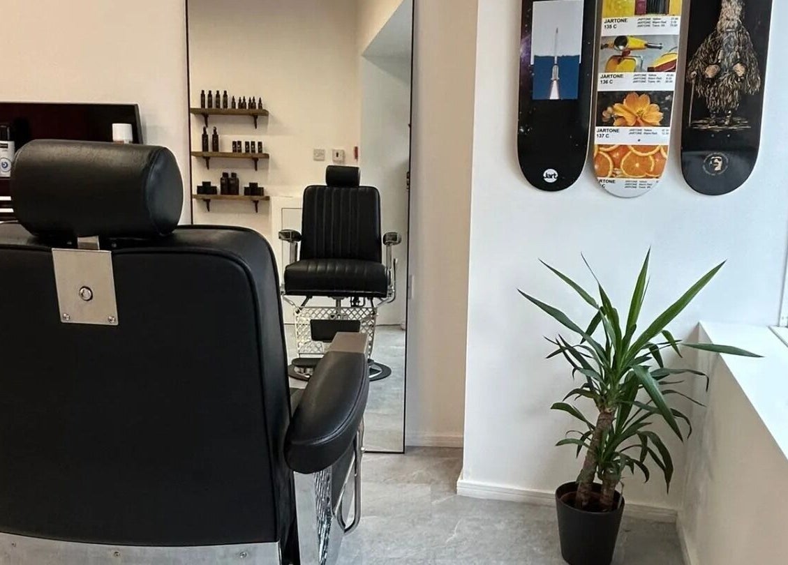 Modern barbershop interior at Handsome Jacks Whitley Bay, featuring sleek chairs in Whitley Bay, England, GB.
