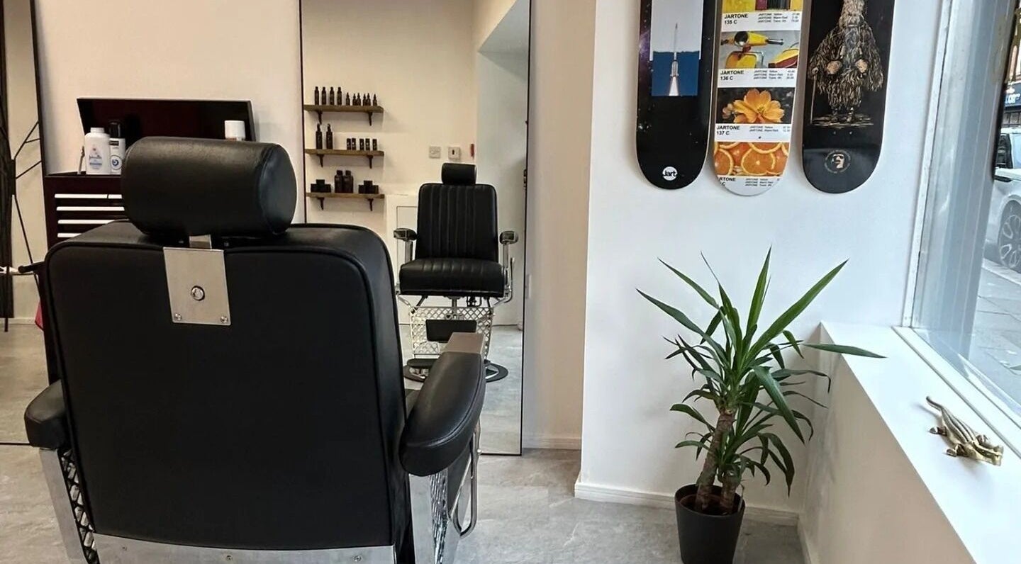 Modern barbershop interior at Handsome Jacks Whitley Bay, featuring sleek chairs in Whitley Bay, England, GB.