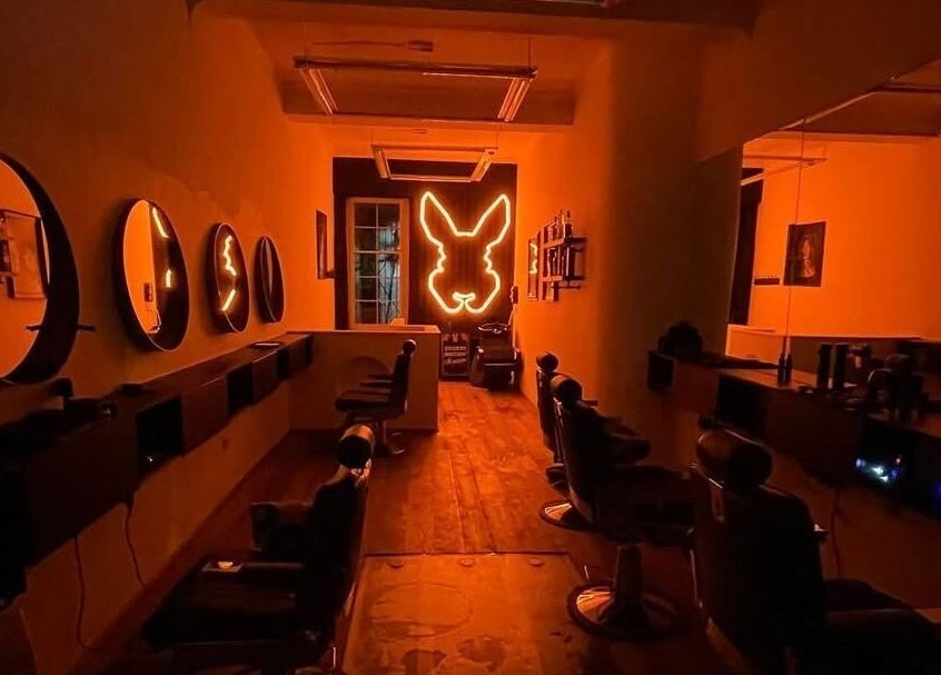 Warm interior of Handsome Jacks Whitley Bay in Whitley Bay, England, GB with neon light and stylish seats.