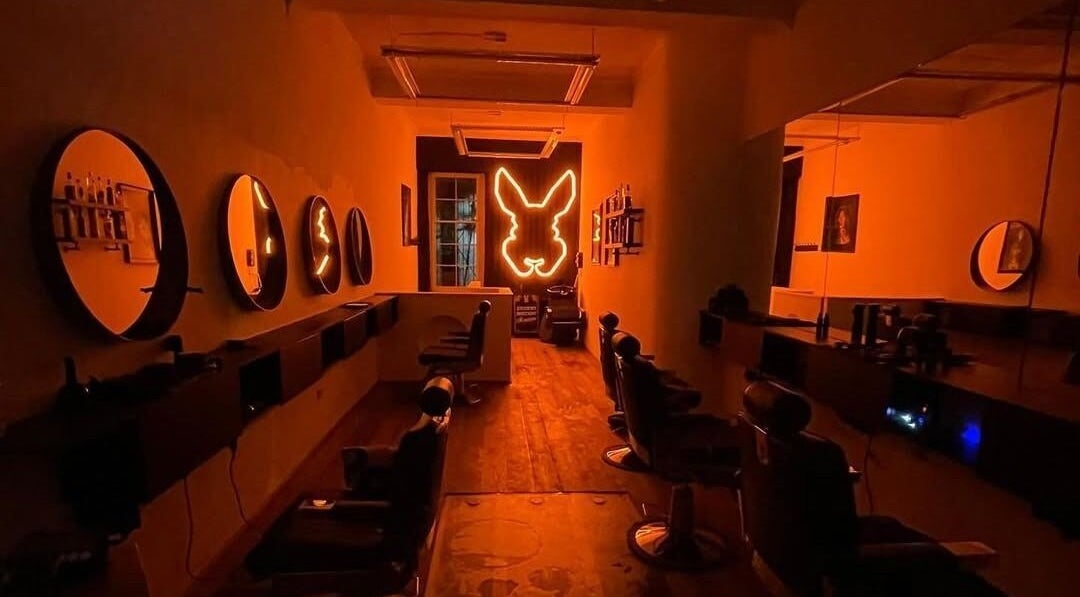 Warm interior of Handsome Jacks Whitley Bay in Whitley Bay, England, GB with neon light and stylish seats.