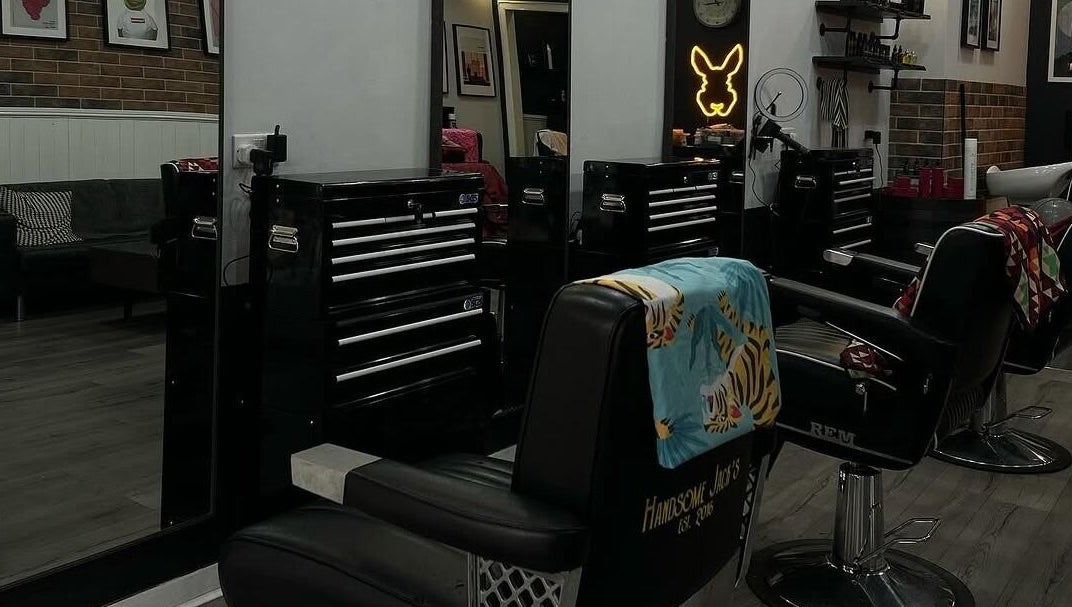 Interior of Handsome Jacks Shawlands in Glasgow, Scotland, GB, featuring stylish barber chairs and modern decor.