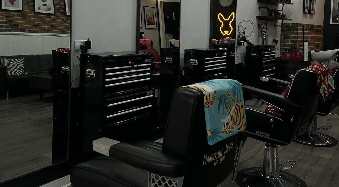 Interior of Handsome Jacks Shawlands in Glasgow, Scotland, GB, featuring stylish barber chairs and modern decor.