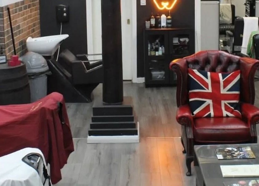 Cozy interior of Handsome Jacks Shawlands in Glasgow, Scotland, GB with vintage decor and union jack chair.