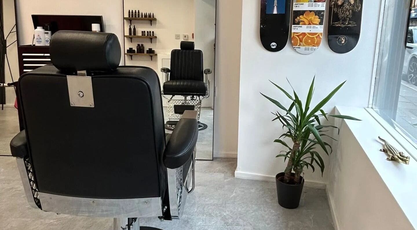 Luxury barber chair at Handsome Jacks Dennistoun in Glasgow, Scotland, GB, with stylish decor and natural light.