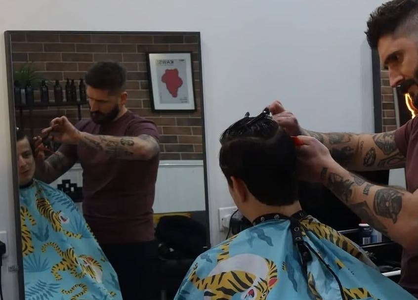 Stylist at Handsome Jacks Dennistoun, Glasgow, Scotland, GB provides expert haircut.