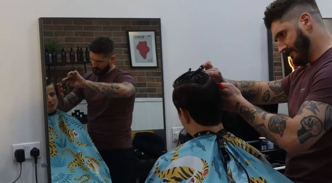 Stylist at Handsome Jacks Dennistoun, Glasgow, Scotland, GB provides expert haircut.