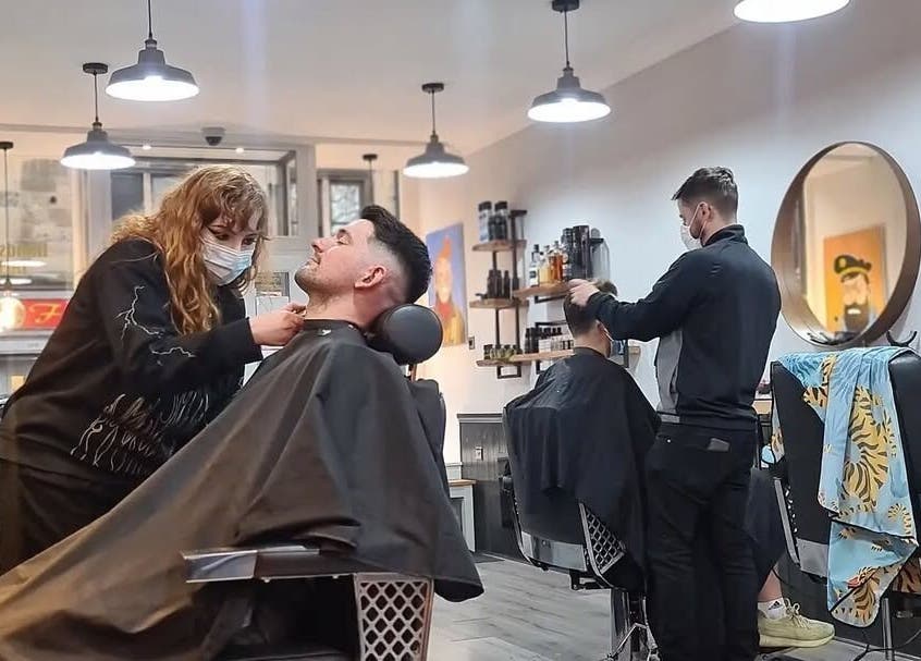 Barbers at Handsome Jacks Dennistoun in Glasgow, Scotland, GB offer grooming services in a modern setting.