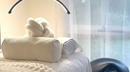 Luxurious spa setup at Barre & Co. Beauty, Melbourne, Victoria, AU, with cozy linens and natural light.