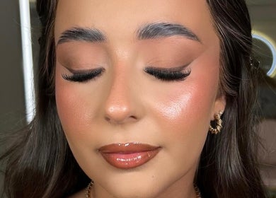 Close-up of elegant makeup by Makeup by Ella, Liverpool, England, GB, showcasing flawless skin and shimmering lips.