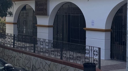 Exterior of Beauty by Alannys in Estepona, Andalucía, ES featuring elegant arches and decorative ironwork.