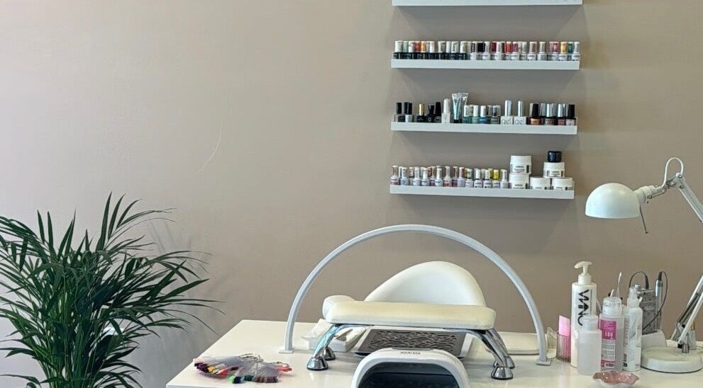 Nail salon station at Beauty by Alannys in Estepona, Andalucía, ES with polish display and manicure tools.
