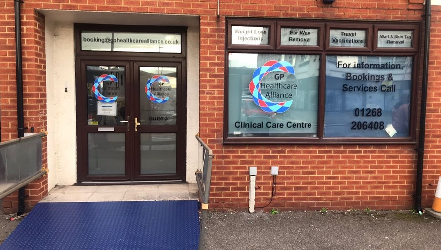 Front entrance of GP Healthcare Alliance in Hadleigh, England, GB. Clinical care center signage visible.
