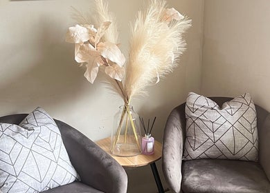 Chic seating area at Fefesnailboutique, Akasia, Gauteng, ZA with plush chairs and elegant decor.