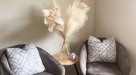 Chic seating area at Fefesnailboutique, Akasia, Gauteng, ZA with plush chairs and elegant decor.