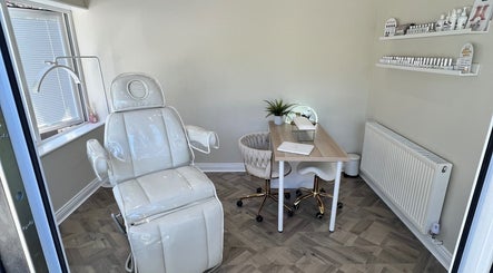 Elegant treatment room at Beauty and Massage by Stef, Higherford, England, GB featuring a plush chair and table.