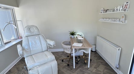 Relaxing treatment room at Beauty and Massage by Stef, Higherford, England, GB, with modern chair and desk.
