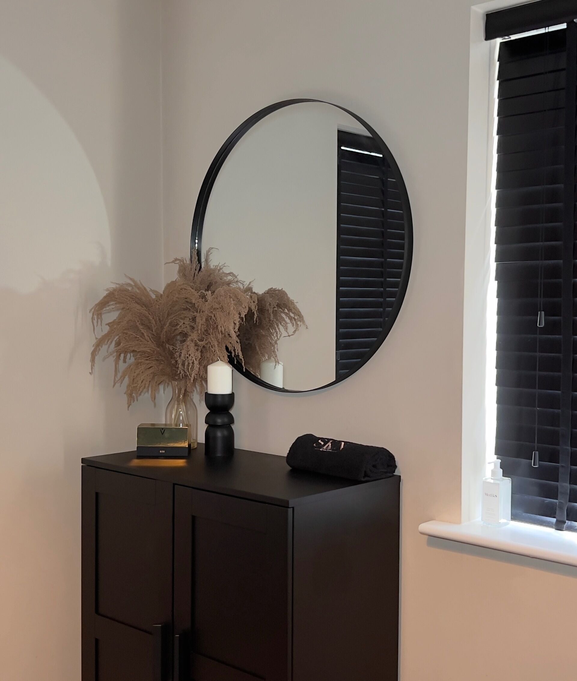 Elegant room at SKN by Scarlett - Warrington, featuring a round mirror and stylish decor in Warrington, England, GB.