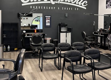 Interior of Cut Republic Connecticut barbershop in Cromwell, CT showcasing sleek chairs and modern decor.