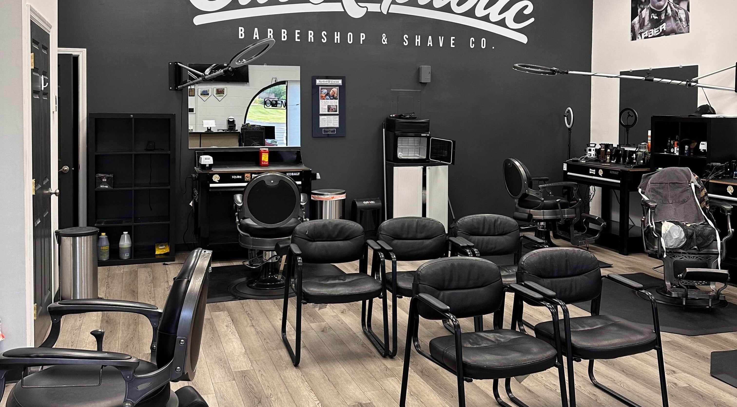 Interior of Cut Republic Connecticut barbershop in Cromwell, CT showcasing sleek chairs and modern decor.