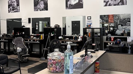 Modern barber interior at Cut Republic Connecticut, Cromwell, Connecticut, US, showcasing chairs and decor.