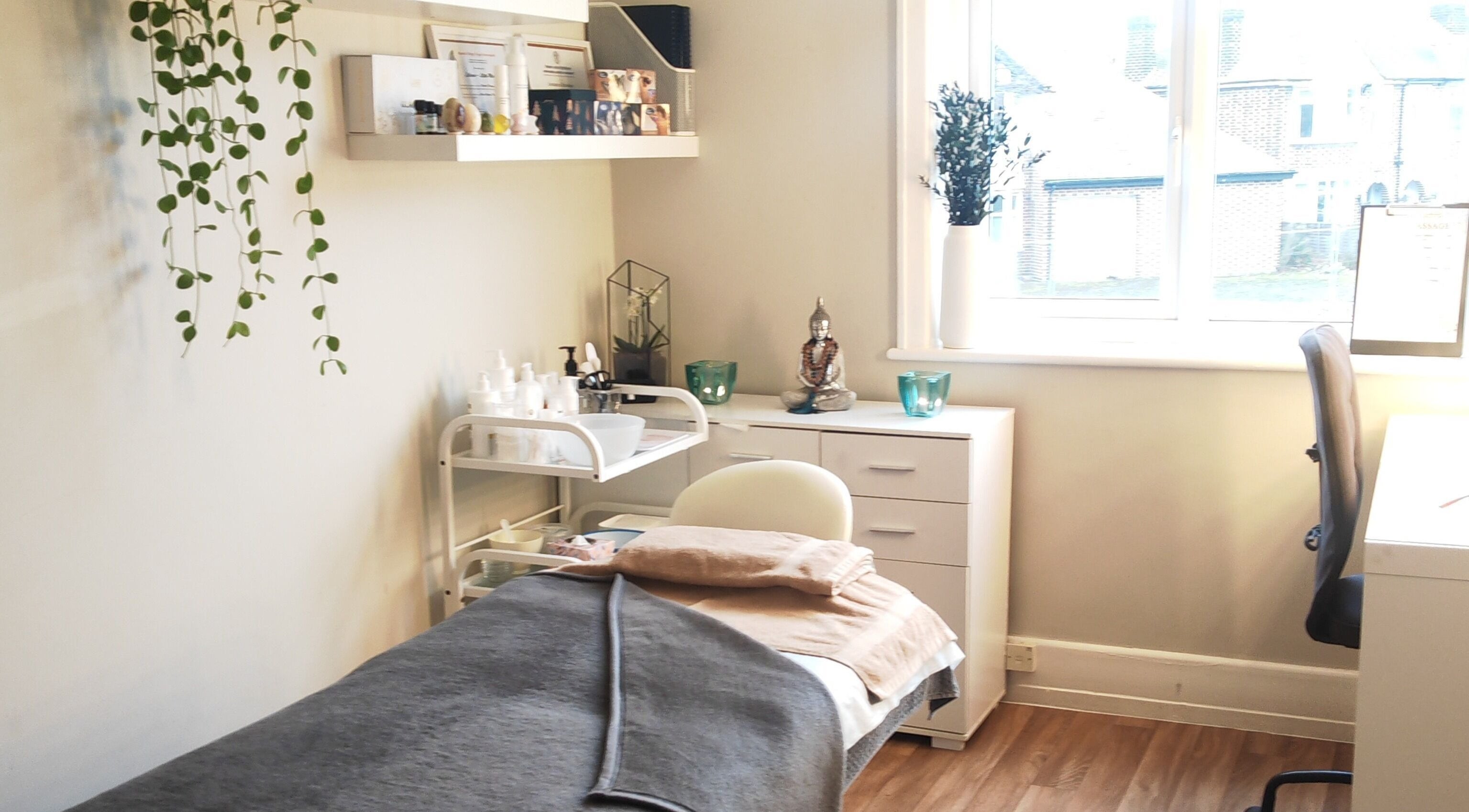 Tranquil therapy room at Lalima Holistics, Coventry, England, GB with massage table and calming decor.