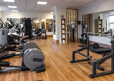 Modern gym at Pullman Fit & Spa Lounge, Stuttgart, Baden-württemberg, DE with top-notch fitness equipment.