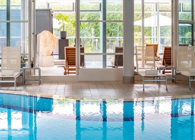 Luxurious pool and lounge chairs at Pullman Fit & Spa Lounge, Stuttgart, Baden-Württemberg, DE.