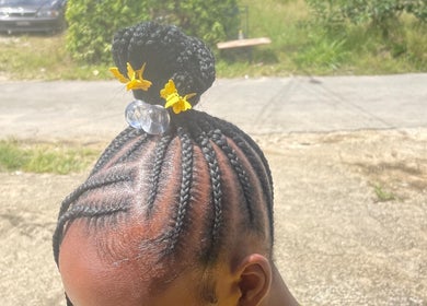 Intricate braids with yellow accents at Hair Affair, Eastlynne, Saint George, BB.