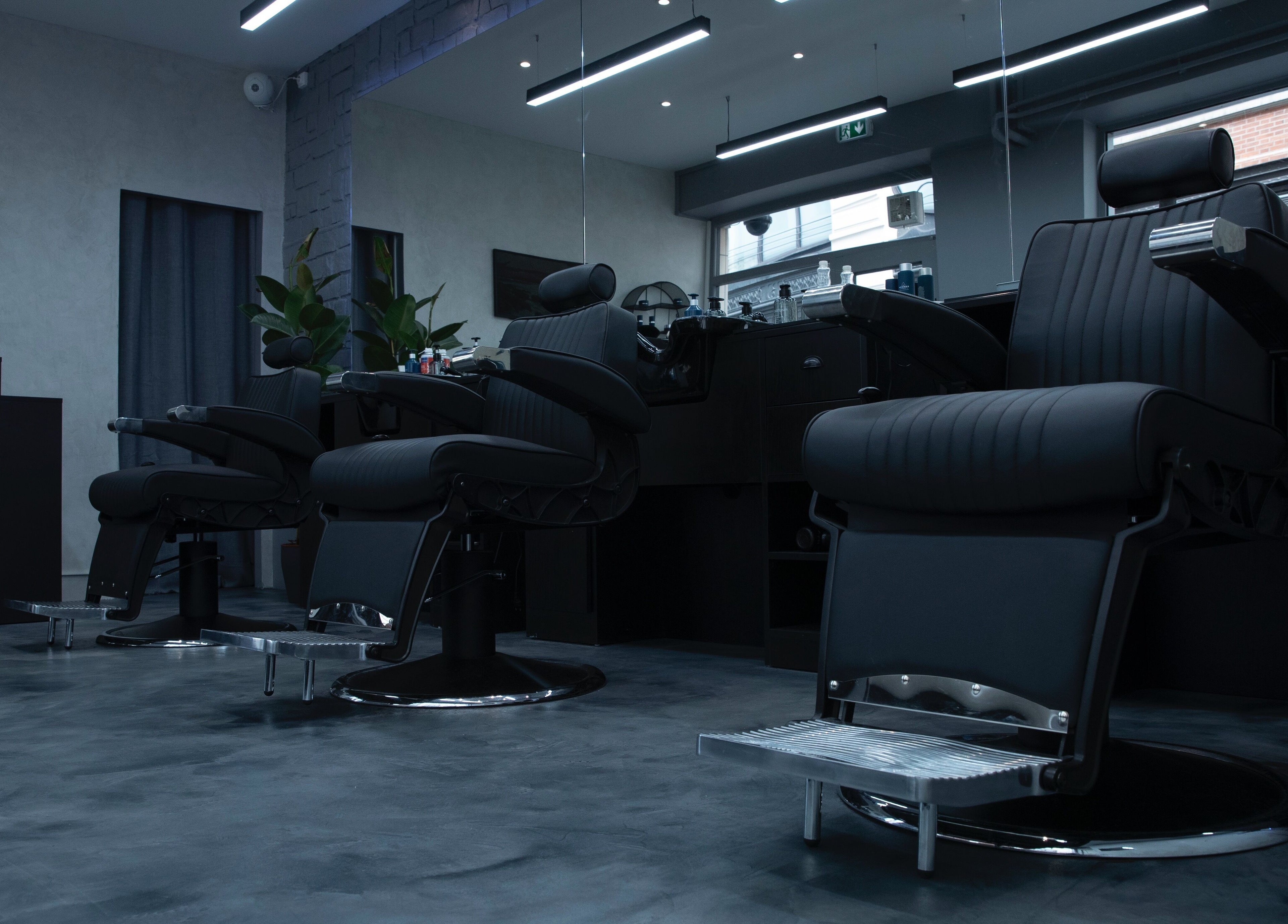 Modern barber chairs at Yanis - NEAT, Paris, Île-de-france, FR, showcasing sleek style and comfort.
